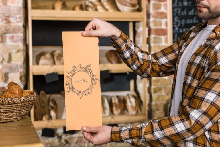 Person holding menu.