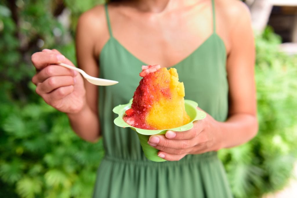 Woman eating a snow cone