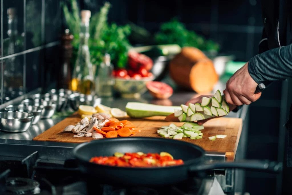 Chef cooking on stovetop.