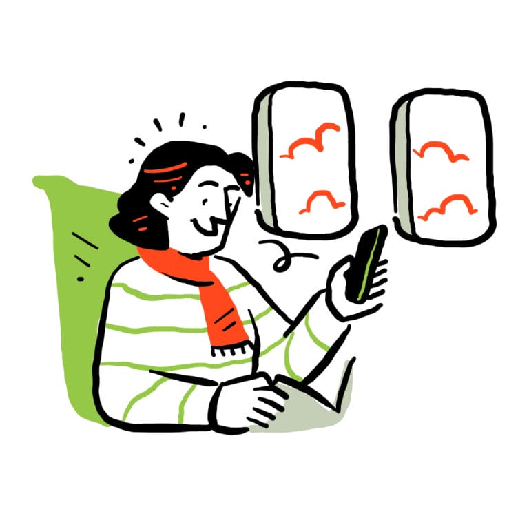 Person using their phone on an airplane.